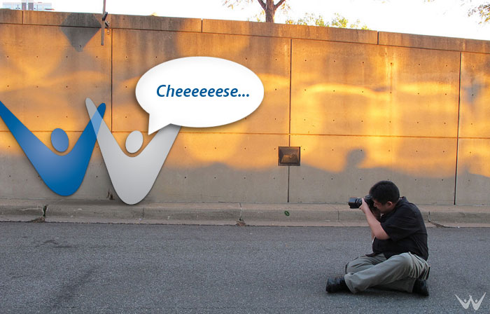 Photographer taking a picture of a wall